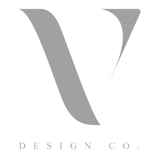 logo-symbol-02 Logo of V Design Co. featuring a stylized, grey, uppercase "V" above the text "DESIGN CO." in grey font on a white background.